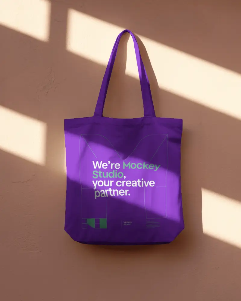 Tote Bag Mockup On Wooden Surface With Angled Sunlight Creating Strong Contrast