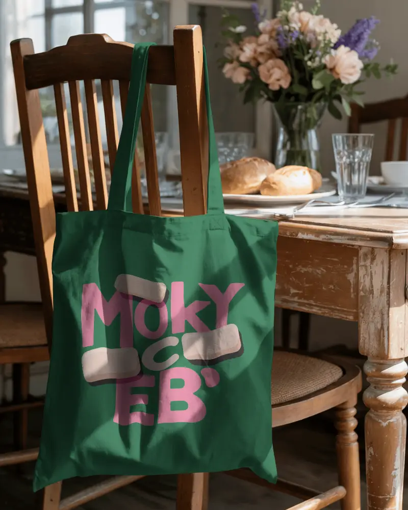 Tote Bag Mockup Hanging On Wooden Chair In Cozy Dining Room Setting