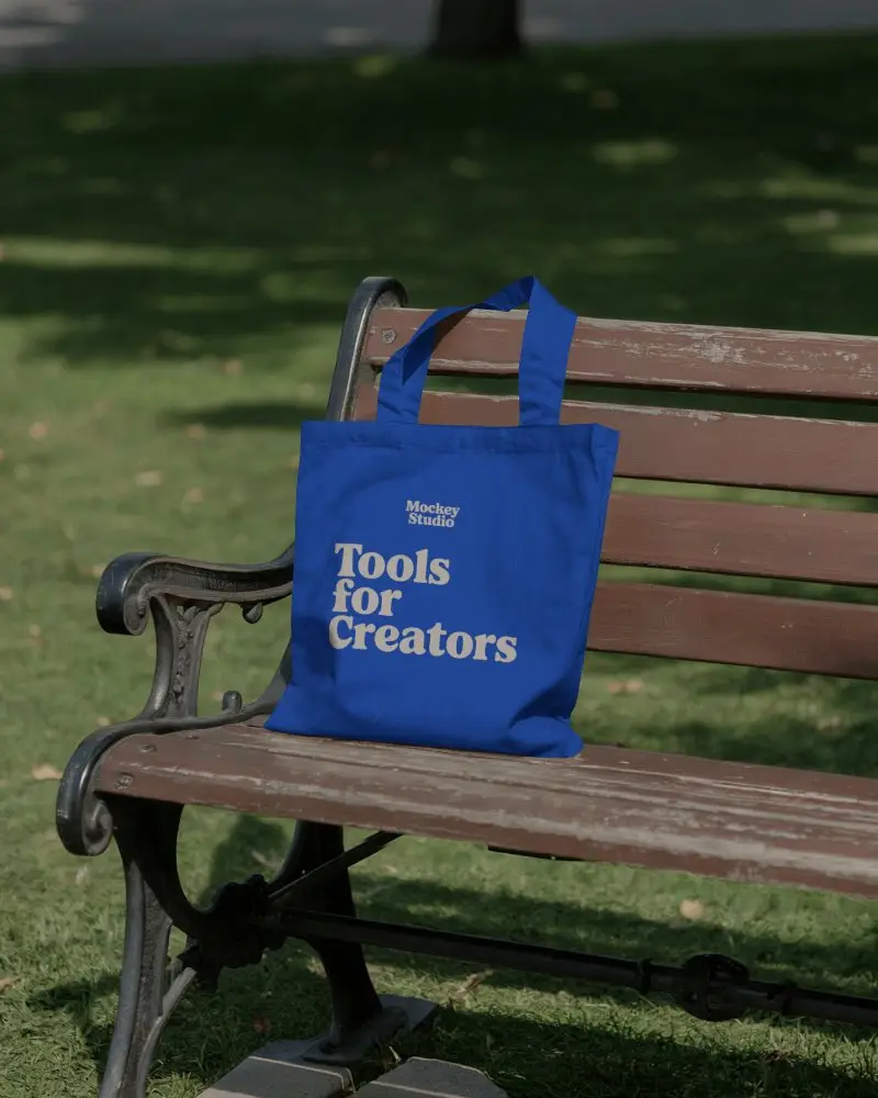 Durable Canvas Tote Bag Hanging On Wooden Bench For Personalized Print Designs