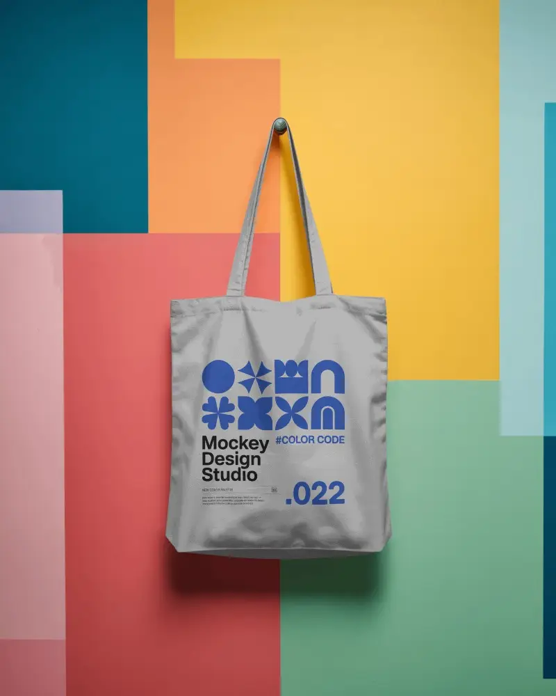 Geometric Colorblock Tote Bag Mockup Hanging Against Modern Art Wall