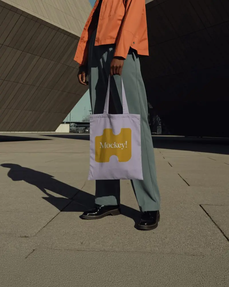 Sunlit Urban Tote Bag Mockup Modern Architecture Background Minimal Fashion Styling Outdoor