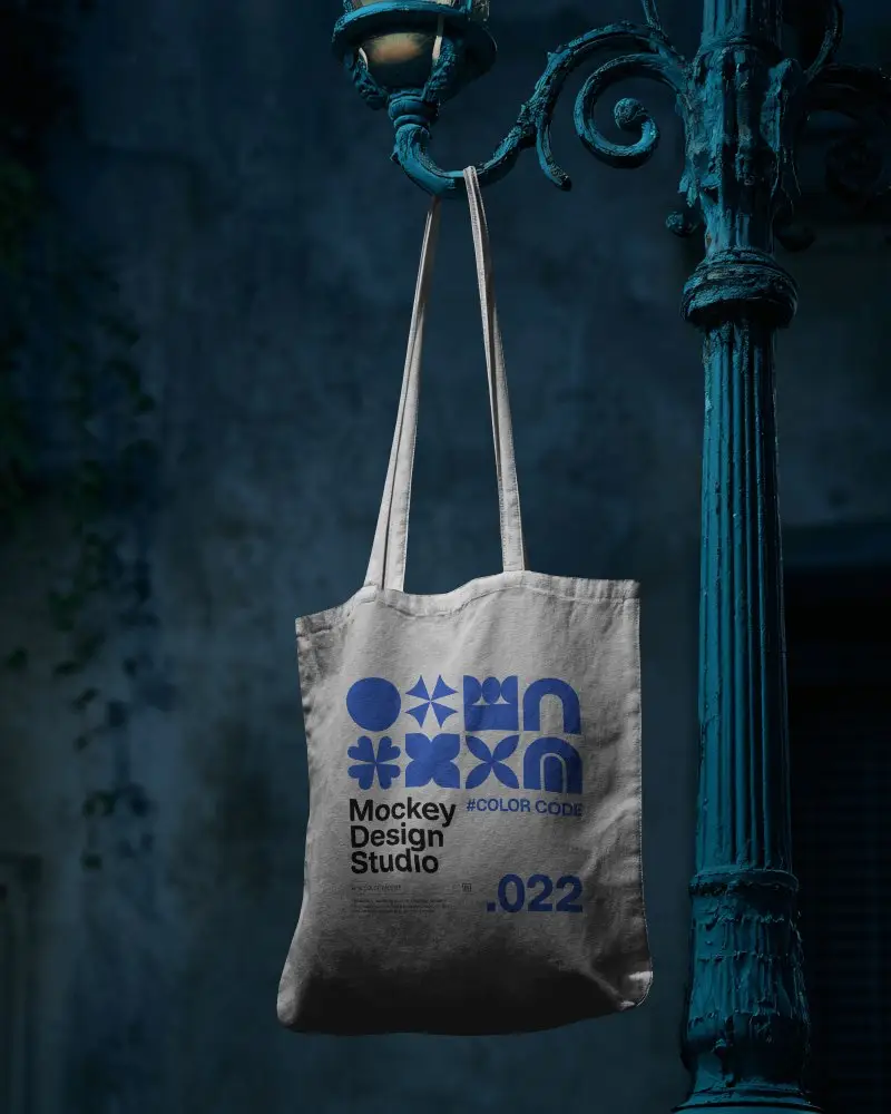 Vintage Streetlamp Totebag Mockup Hanging In Moody Night Urban Setting With Cinematic Blue Tones