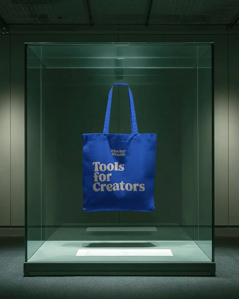 Museum Display Totebag Mockup Suspended In Glass Case With Minimal Green Gallery Light