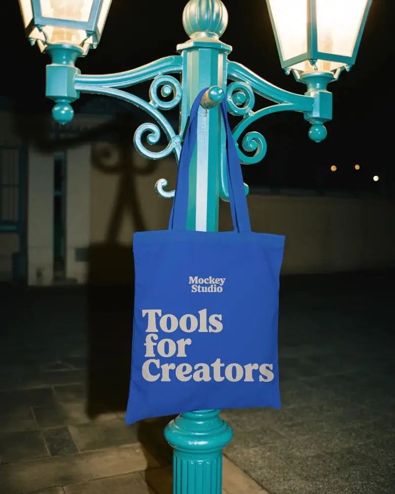 Eco Friendly Tote Bag Mockup Hanging On Vintage Street Lamp For Clean Tote Design Display