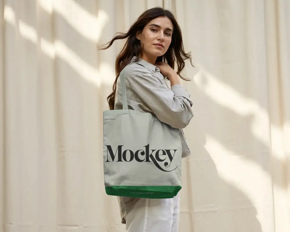 Eco Friendly Tote Bag Mockup Showcased By Urban Model In Natural Light Background