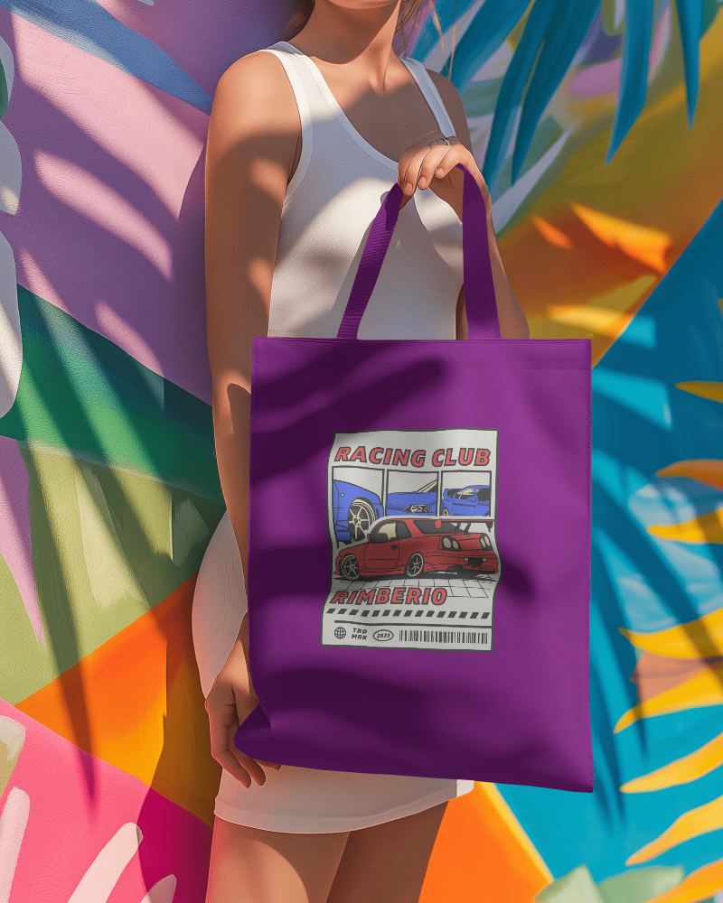 Totebag Mockup Getting Displayed By A Female In Front Of Colorful Wall