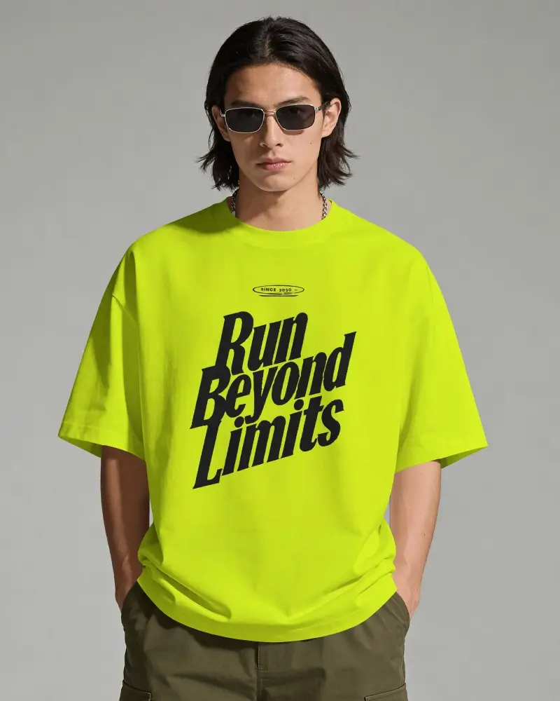 Front View T Shirt Mockup Male Model Standing Hands In Pockets Clean Studio Background