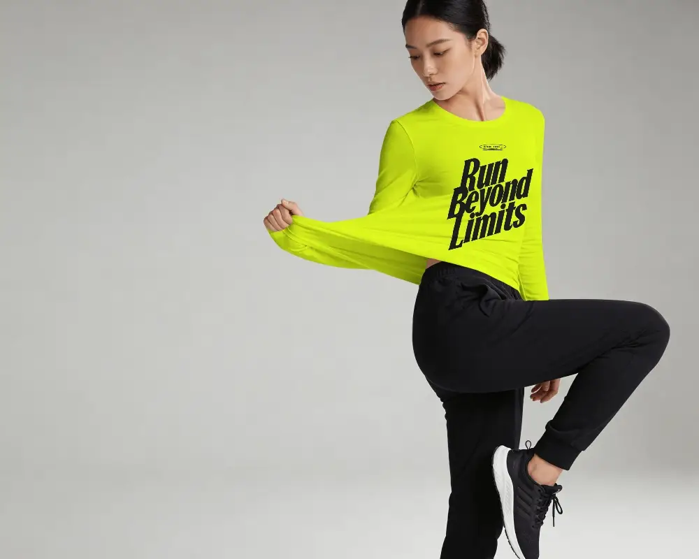 Stretch Action T Shirt Mockup Female Model Pulling Fabric Side Pose Clean Studio