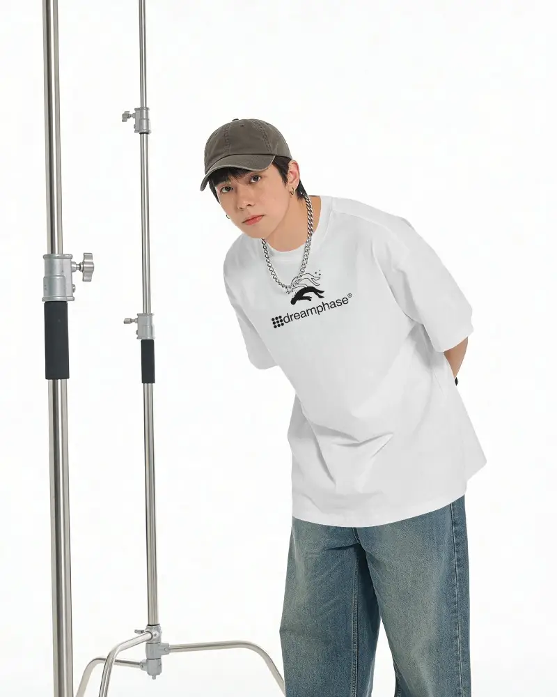 Leaning Pose T Shirt Mockup Male Model Bending Forward Hands Behind Back Studio Setup