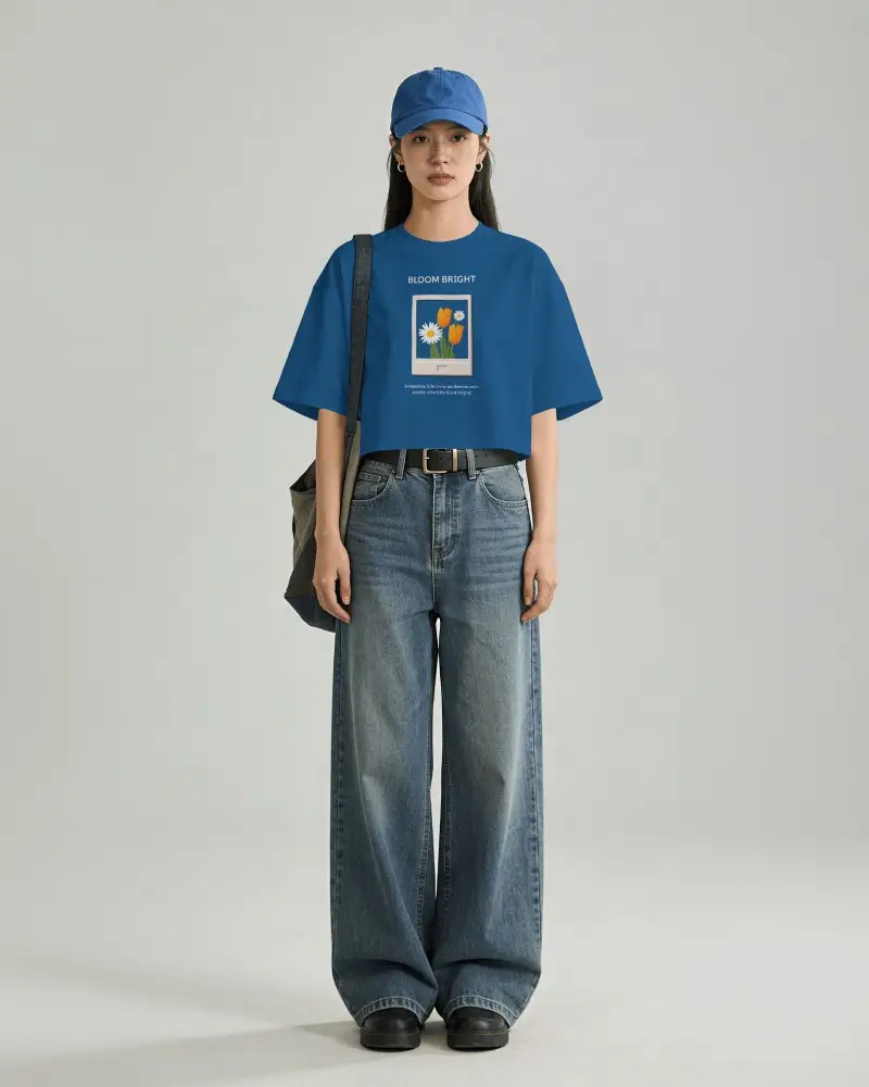 Full Body T Shirt Mockup Female Model Standing With Bag And Cap Clean Studio Background