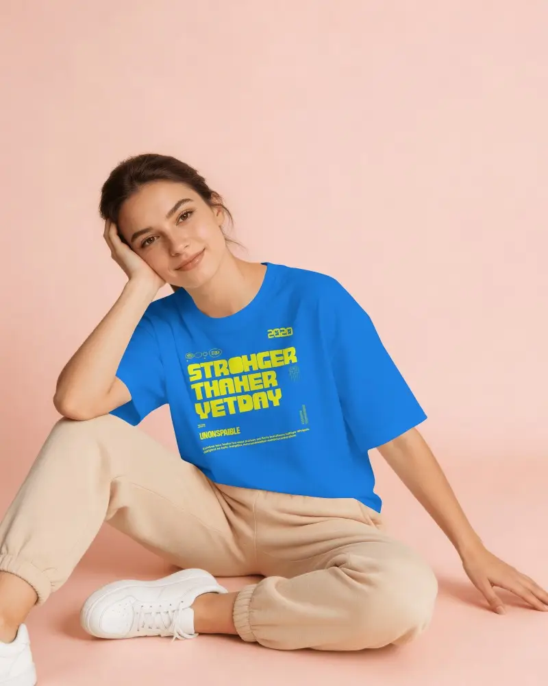 Soft Pastel T Shirt Mockup Female Model Sitting Relaxed Pose Peach Background