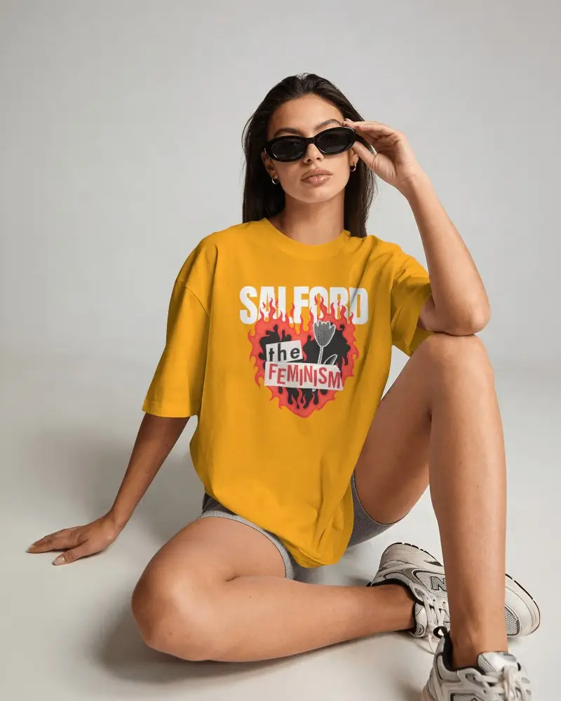 Amazon Tshirt Mockup Female Model Sitting On Studio Floor Wearing Sunglasses With Casual Fashion