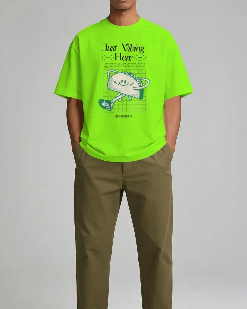 Printful Tshirt Mockup Male Model Standing Front View With Hands In Pockets Against Minimal Studio