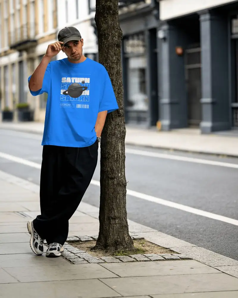 Streetwear Tshirt Mockup Male Model Standing Beside Tree On City Sidewalk In Urban Lifestyle Scene