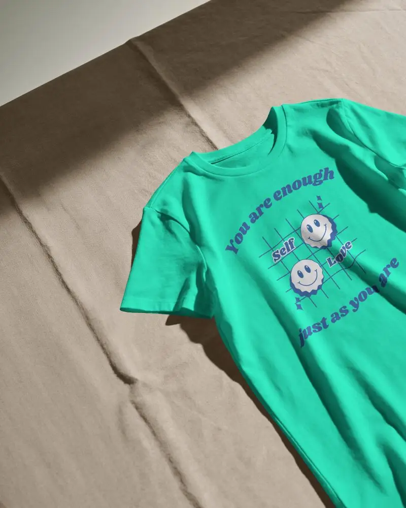 Flat Lay T Shirt Mockup On Beige Fabric Surface With Hard Sunlight And Natural Shadow Depth