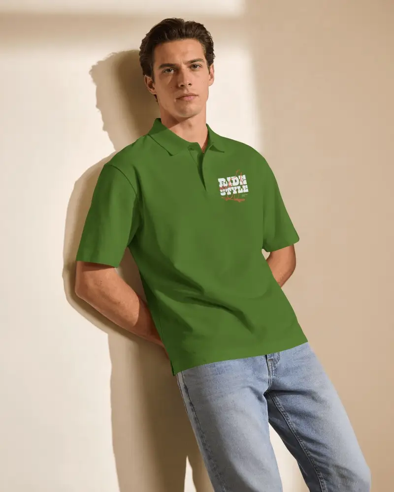 Sunlit Interior Polo Shirt Mockup On Male Model Leaning Against Wall With Soft Window Shadow