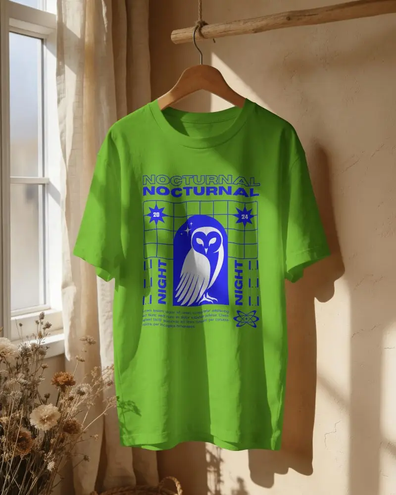 Sunlit Window T Shirt Mockup Hanging On Wooden Hanger With Soft Curtain Light And Dried Flower Deco