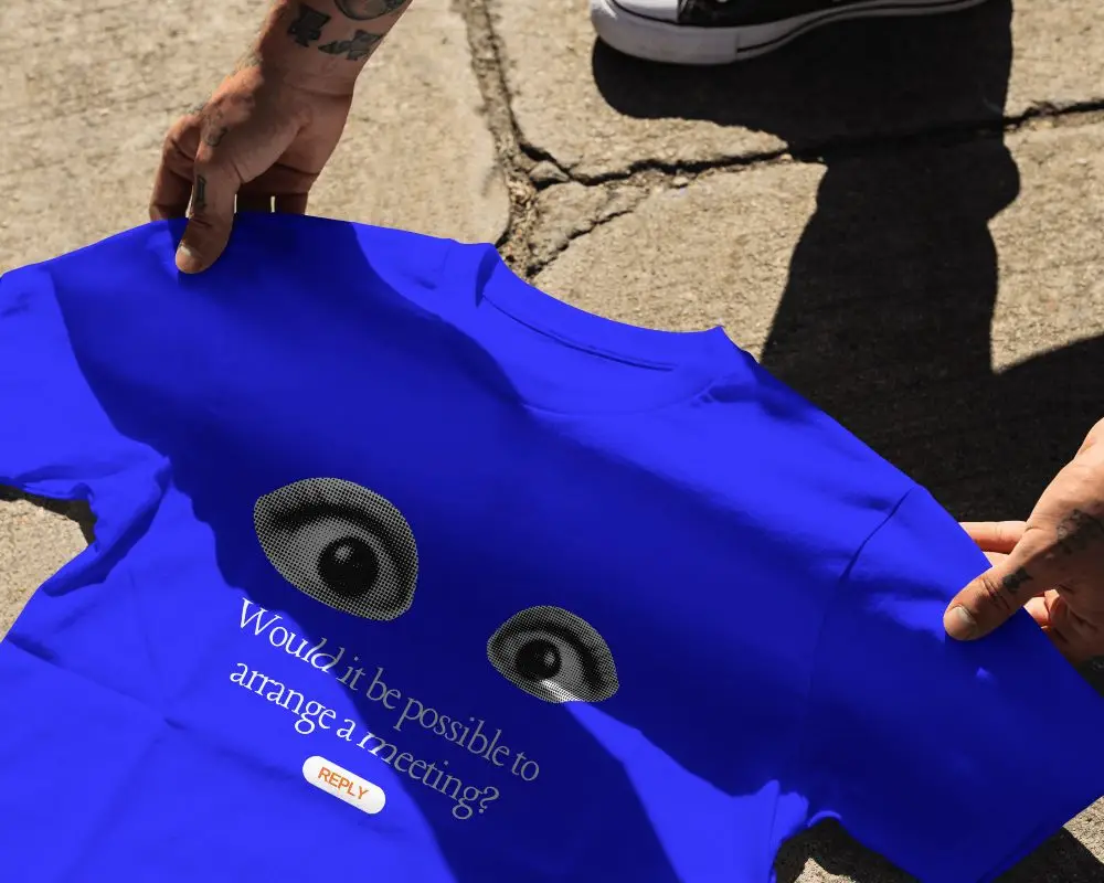 Outdoor Streetwear T Shirt Mockup With Hands Adjusting Shirt On Textured Concrete Ground