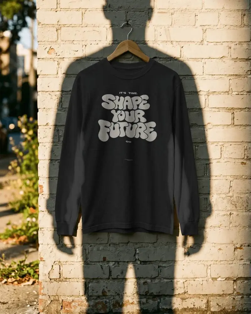 Long Sleeve Cotton Tshirt Mockup On Hanger Against Textured Brick Wall Background