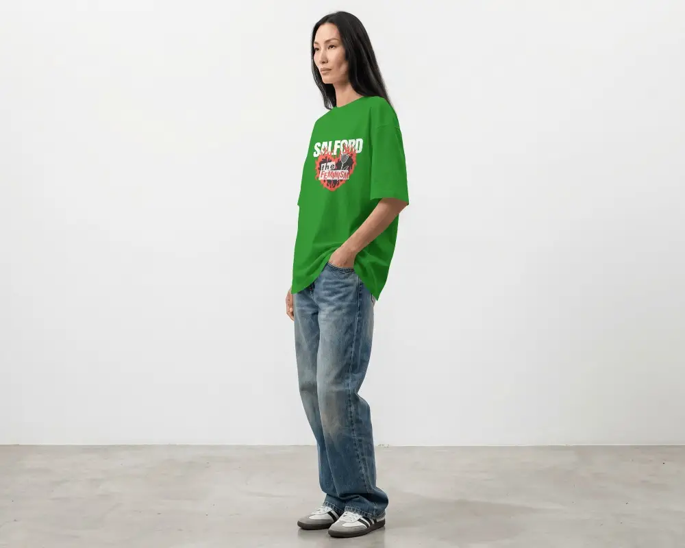 Side Profile T Shirt Mockup Female Model Standing In Minimal Studio With Relaxed Fashion Pose