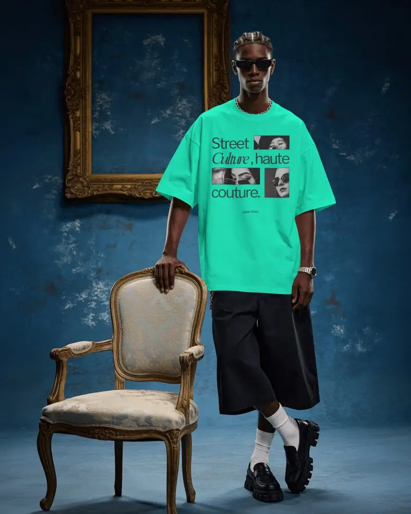 Luxury Editorial T Shirt Mockup Male Model Standing Beside Vintage Chair In Art Gallery Style Room