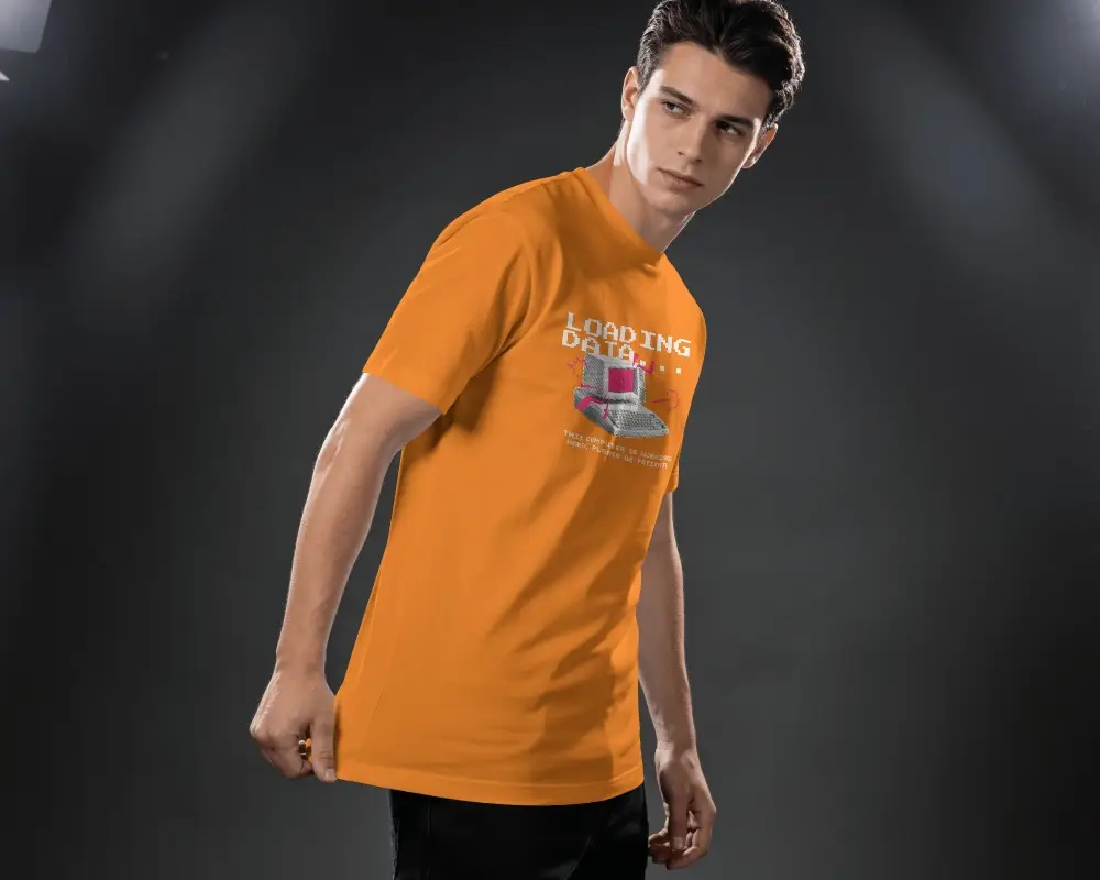 Dark Studio T Shirt Mockup Male Model Pulling Hem With Dramatic Editorial Lighting