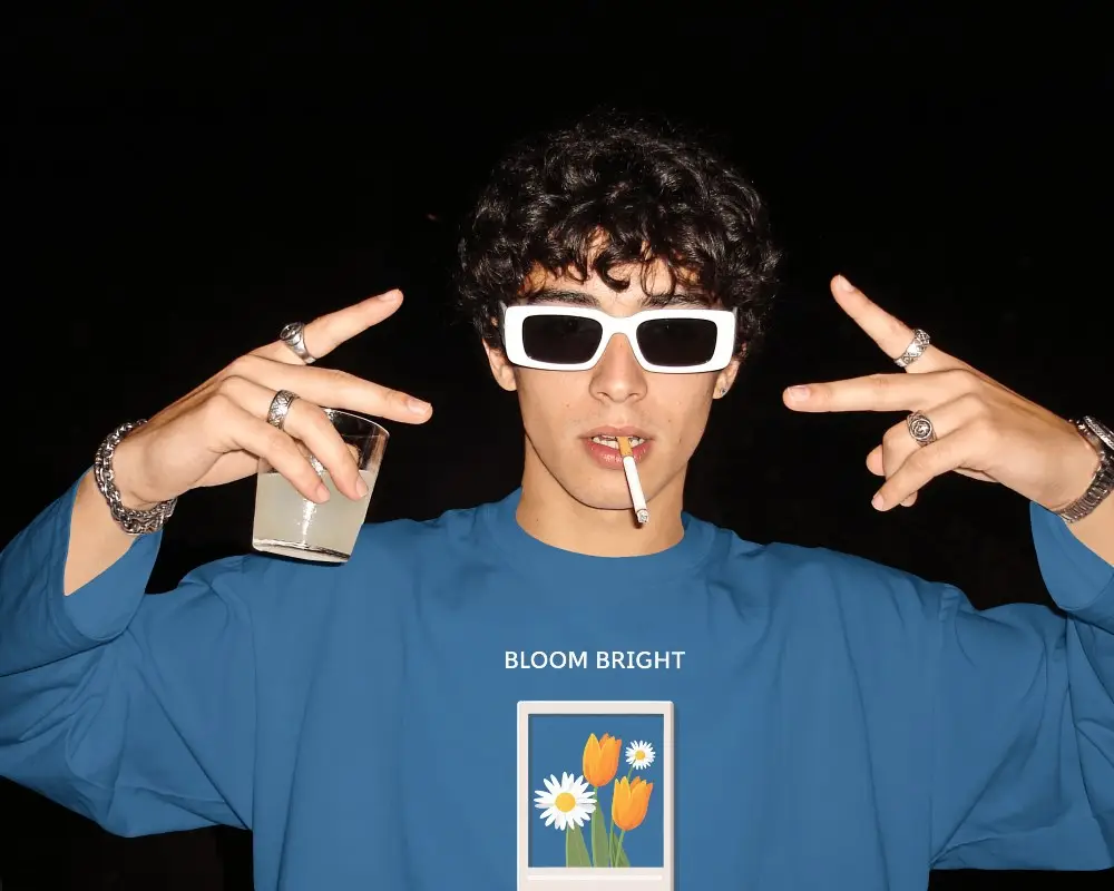 Nightlife Style T Shirt Mockup Male Model Wearing White Sunglasses Against Dark Party Background