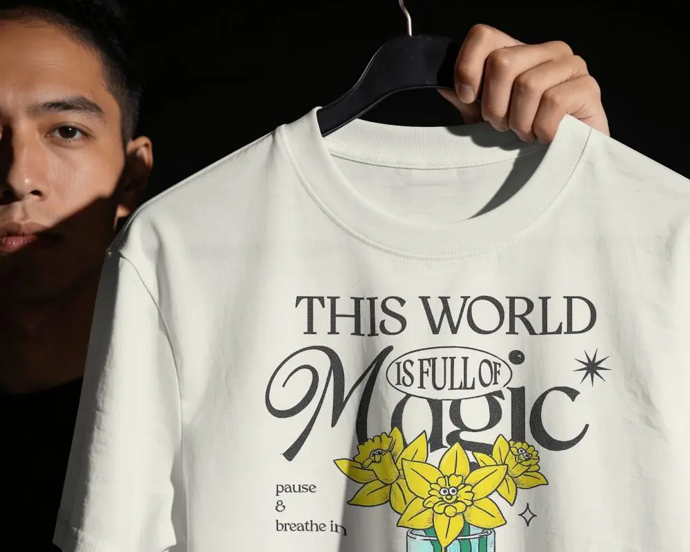 Dramatic Studio T Shirt Mockup Male Model Holding Hanger With Close Up Collar Detail