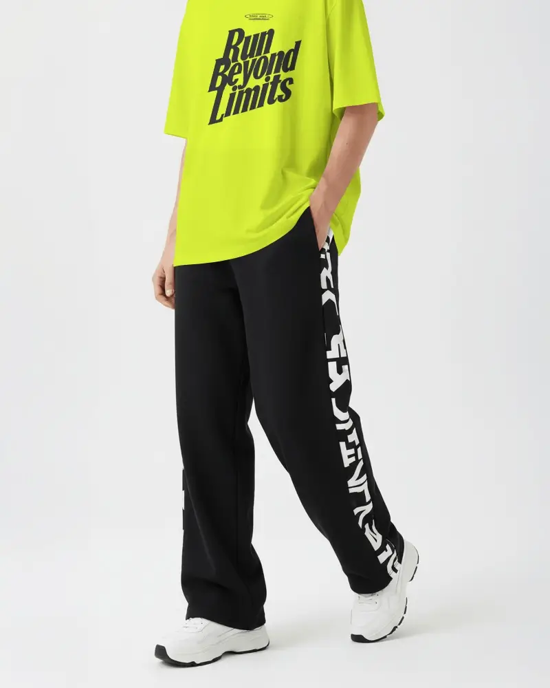 Minimal Studio T Shirt Mockup Cropped Male Model Shot With Casual Streetwear Pants Product Focus