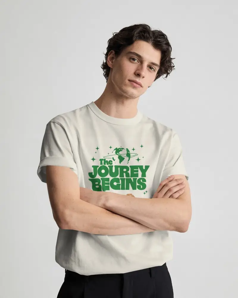 Arms Crossed Mens T Shirt Mockup With Tilted Head And Confident Direct Gaze In Minimal Studio