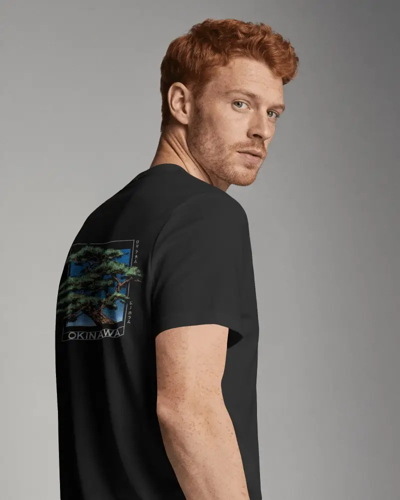 Freckled Male Model T Shirt Mockup Showcasing Upper Back Print Area And Confident Sideward Gaze