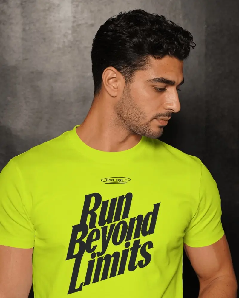 Moody Fashion T Shirt Mockup With Male Model Turning Head Downward In Contemplative Pose