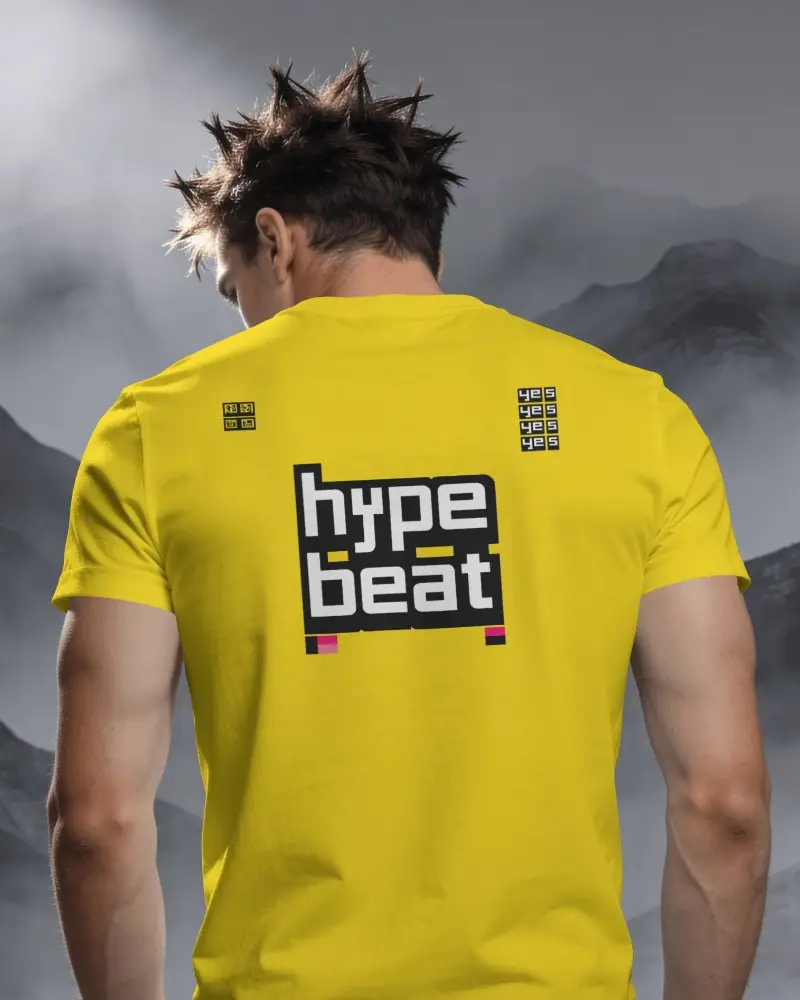 Mountain Backdrop T Shirt Mockup With Male Model Facing Away Amid Layered Mist And Rugged Peaks