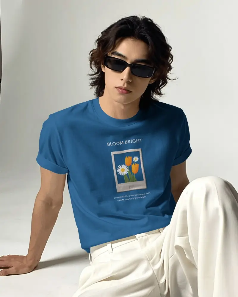 Seated Mens T Shirt Mockup With Wavy Haired Model Wearing Sunglasses In Relaxed Editorial Pose
