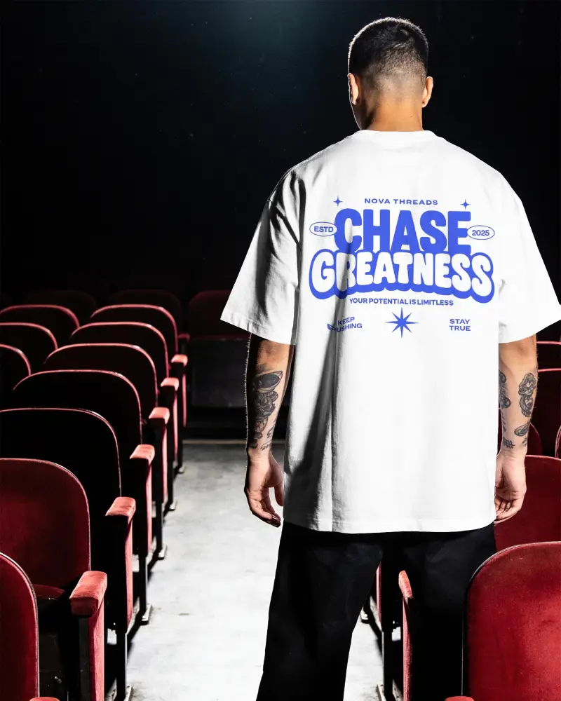 Back View Tshirt Mockup Of Man Wearing Loose Fit Shirt In Audience Seating Environment