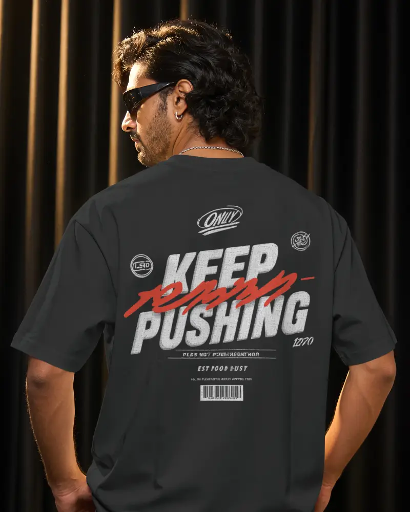 Back View T Shirt Mockup Male Model Standing In Dramatic Curtain Lit Studio