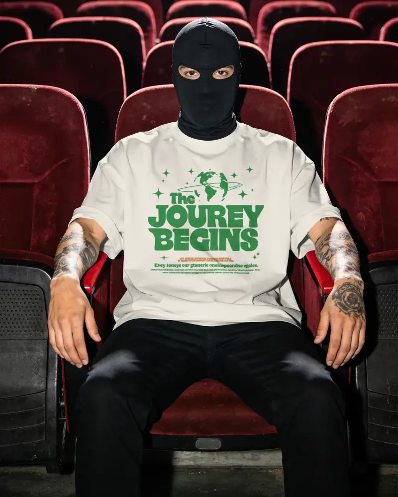 T Shirt Mockup Masked Male Model In Theater Seat With Direct Camera Pose