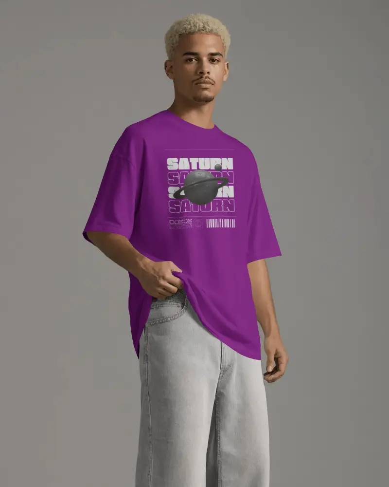 Oversized Mens T Shirt Mockup With Blond Haired Model Lifting Hem And Standing In Relaxed Studio