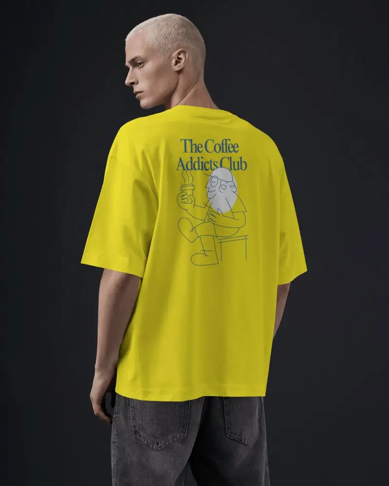 Rear Angle T Shirt Mockup On Male Model Dropped Shoulders Wide Sleeves And Natural Fabric