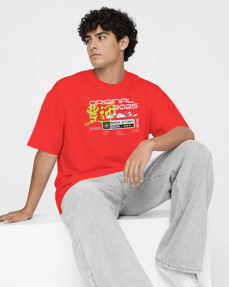 Seated Men T Shirt Mockup Curly Haired Model Resting One Arm On Raised Knee Looking Sideways