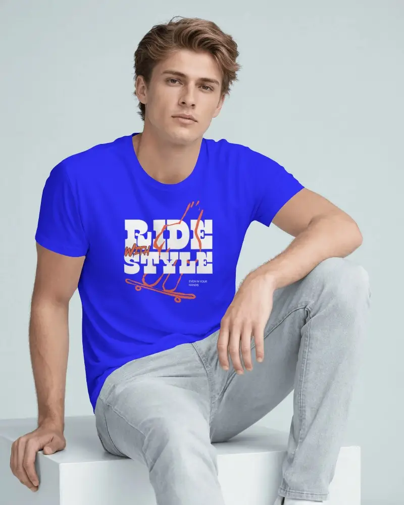 Seated Mens T Shirt Mockup With Model Resting Forearm On Raised Knee And Relaxed Direct Gaze