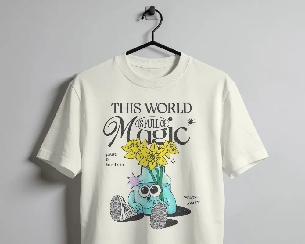 T Shirt Mockup Hanging On Black Wire Hanger Against Minimal White Wall With Soft Shadows