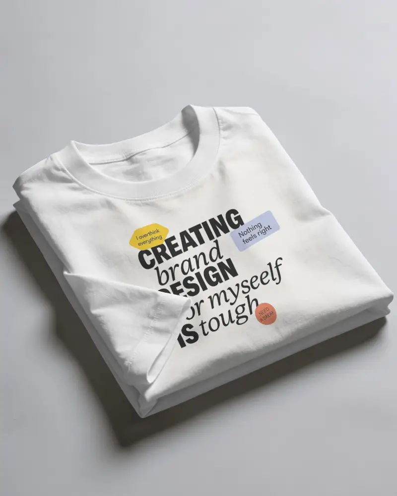 Folded T Shirt Mockup Stacked On Minimalist Surface With Soft Directional Lighting And Deep Shadows