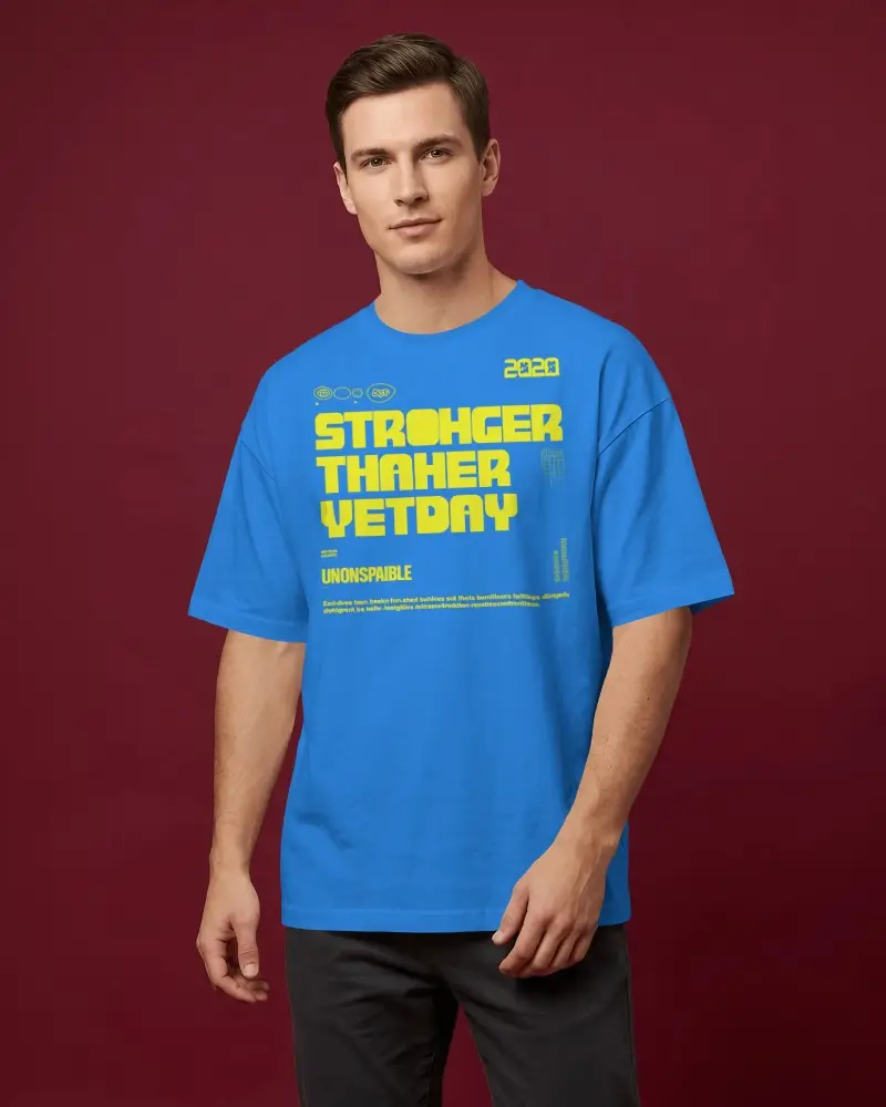 Mens T Shirt Mockup Model Standing Against Deep Burgundy Studio Backdrop In Editorial Portrait