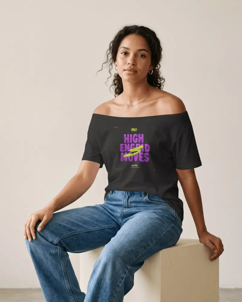 Off Shoulder T Shirt Mockup Woman Model In Denim Jeans Seated In Minimalist Fashion Studio