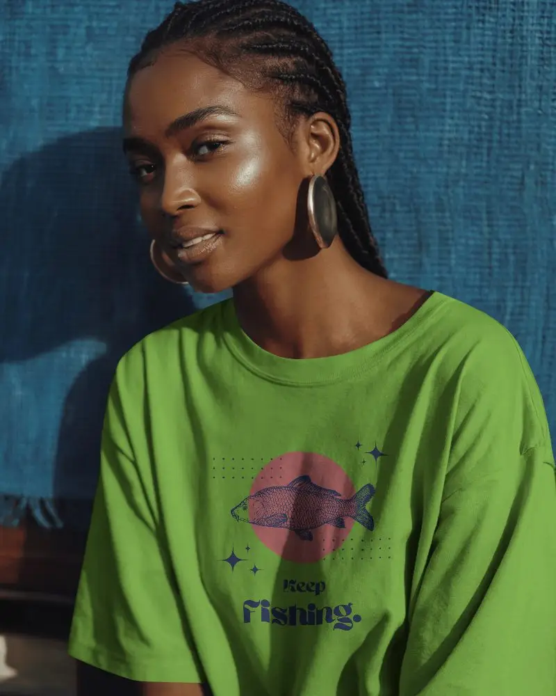 Outdoor Lifestyle Tshirt Mockup Sunlit Scene Featuring Female Model In Relaxed Pose And Blue Backdrop