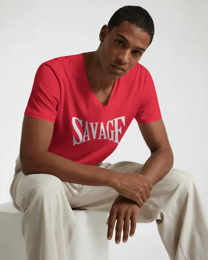 Studio Lit V Neck Tshirt Mockup Male Model Sitting On White Stool In Minimal Background Soft Shadows Modern Pose