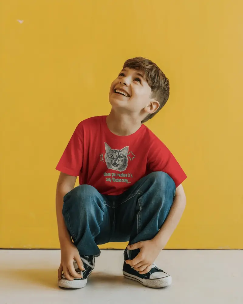 Vibrant Kidswear Tshirt Mockup Boy In Minimal Outfit Squatting And Smiling On White Floor