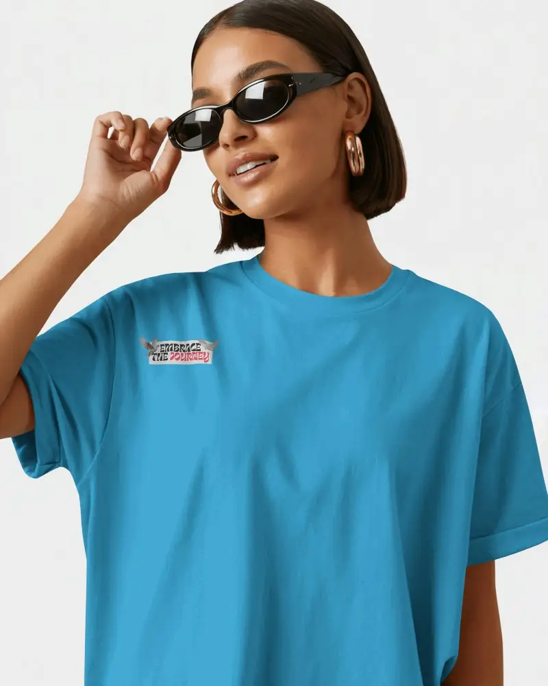 Bold Streetwear T Shirt Mockup Woman In Round Sunglasses Smiling Against Minimal Light Background