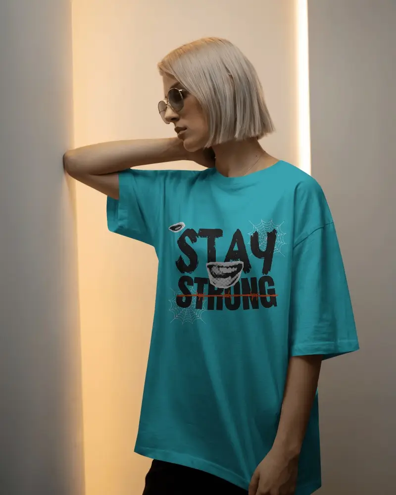 Soft Glow Studio T Shirt Mockup Female Model With Short Blonde Bob And Sunglasses In Minimal Light